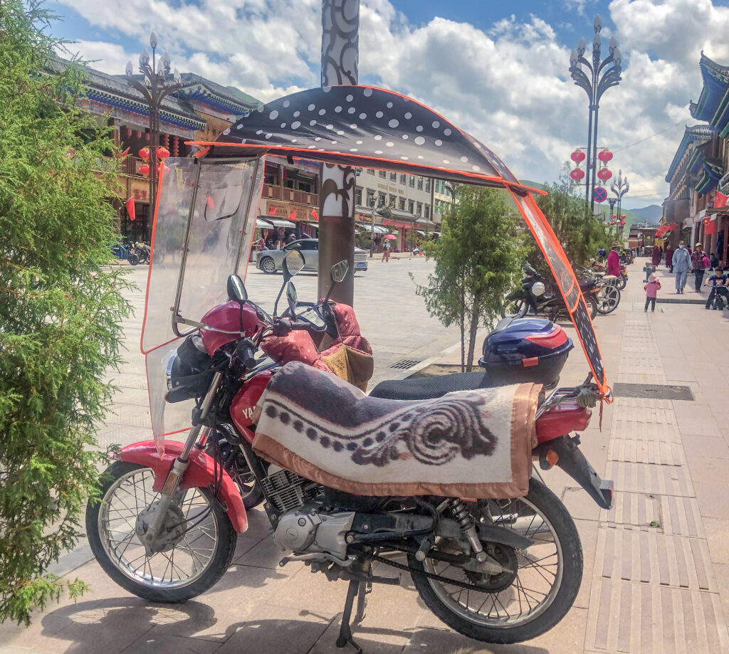 Motorbike with rain-roof